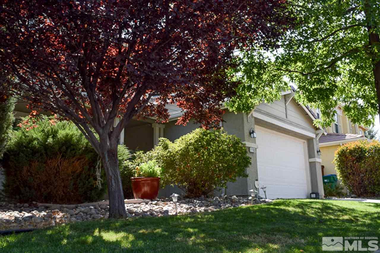 11180 Parma Way Reno, NV 89521 - Photo 3 of 37 a backyard of a house with lots of green space