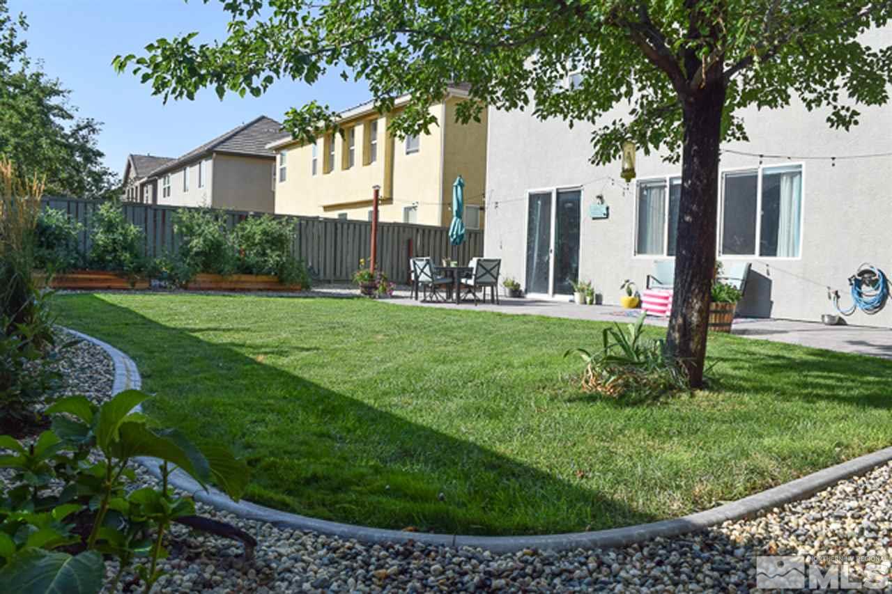 11180 Parma Way Reno, NV 89521 - Photo 33 of 37 a view of a backyard with a garden and plants