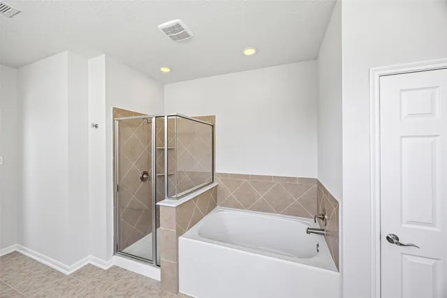 a view of an empty room with windows