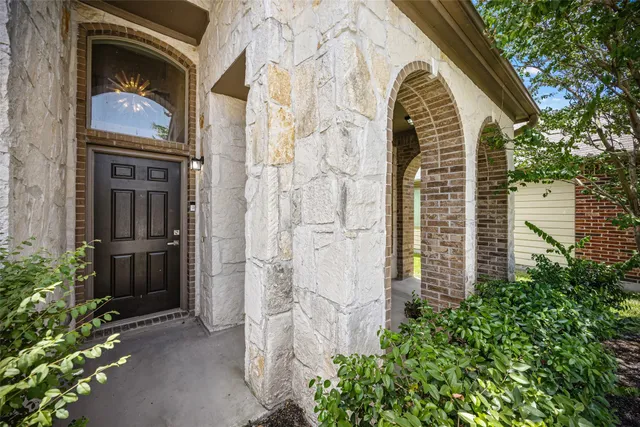a view of a house with a door and balcony
