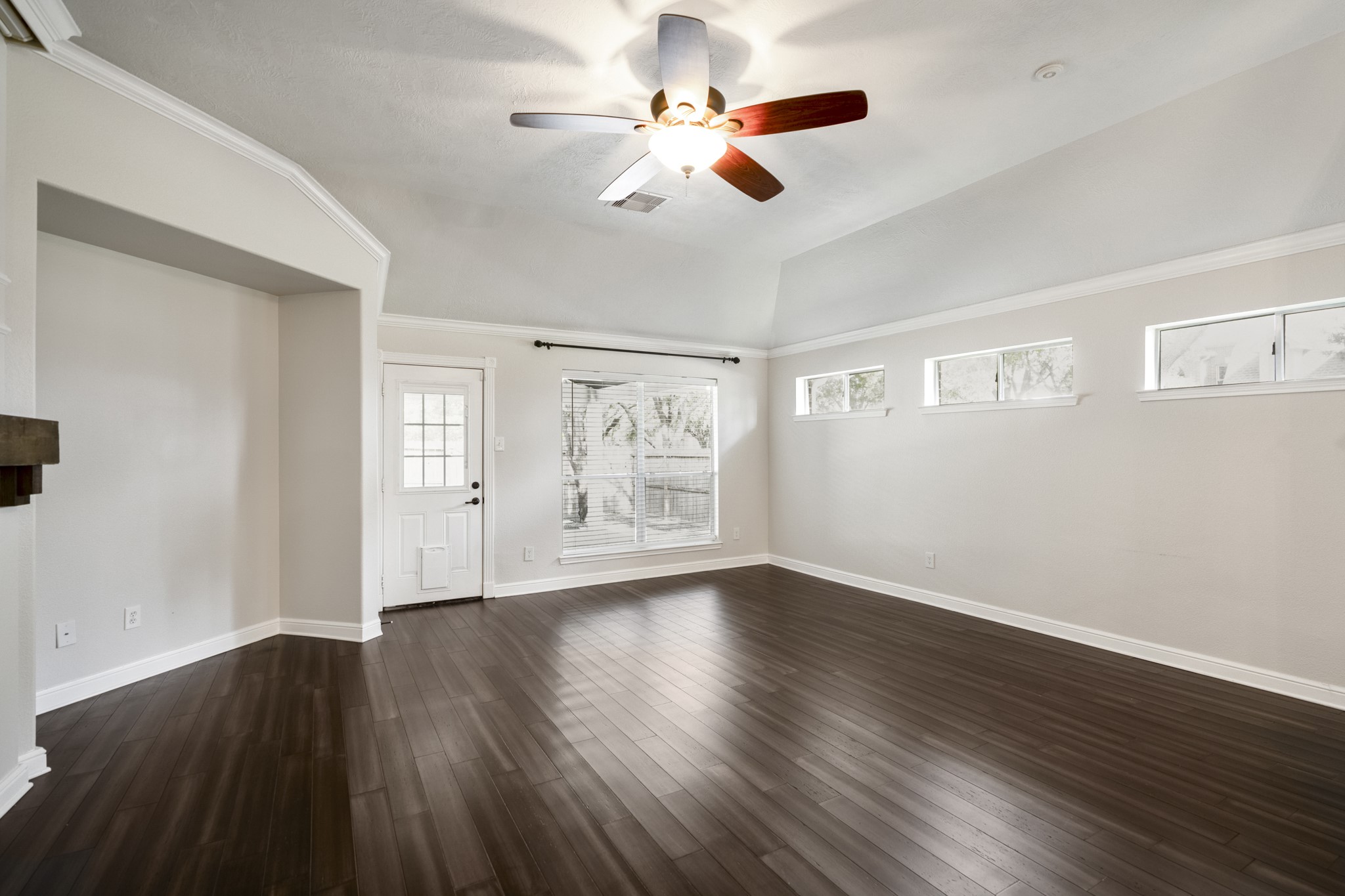 5802 Sawyer Bend Lane Spring, TX 77379 - Photo 15 of 50 a view of an empty room with wooden floor and a window