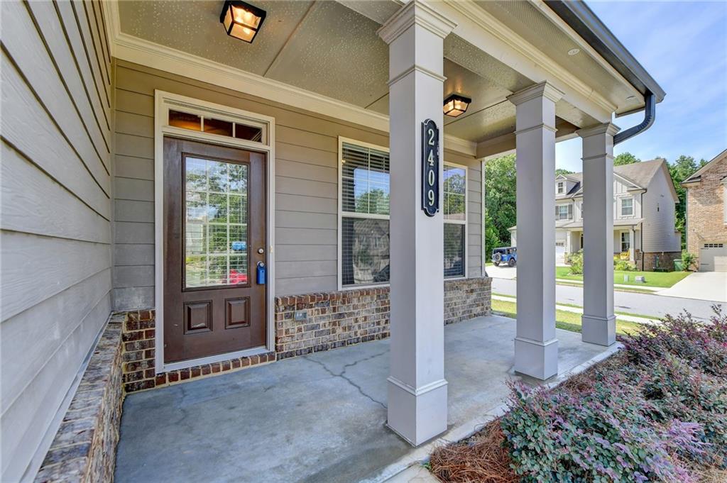 2409 Ivy Meadow Lane Buford, GA 30519 - Photo 3 of 32 a view of front door of house