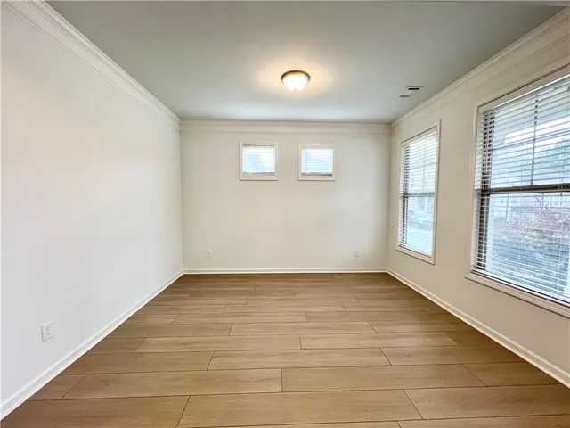 a view of an empty room with glass door