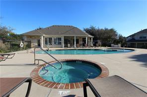 1900 Scofield Ridge Parkway, Unit 4701 Austin, TX 78727 - Photo 21 of 27 Relax poolside in the sparkling waters, complemented by a cozy spa and inviting clubhouse.