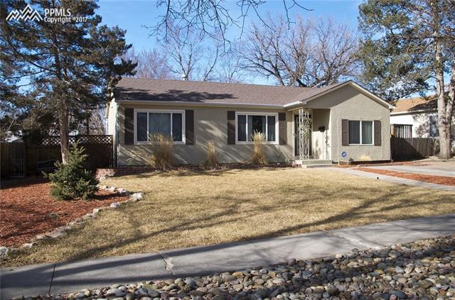 2446 Lafayette Road Colorado Springs, CO 80907 - Photo 2 of 17 Mature trees, well-maintained landscaping, and auto sprinklers.