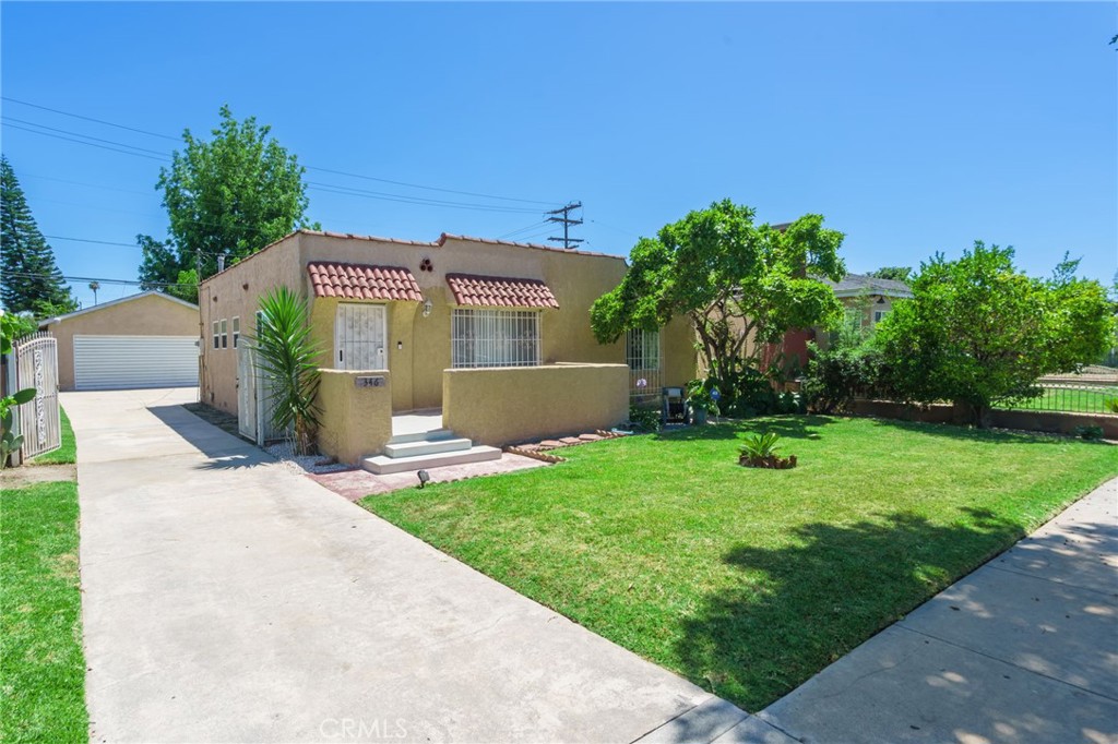 346 West School Street Compton, CA 90220 - Photo 6 of 29 front view of a house with a yard