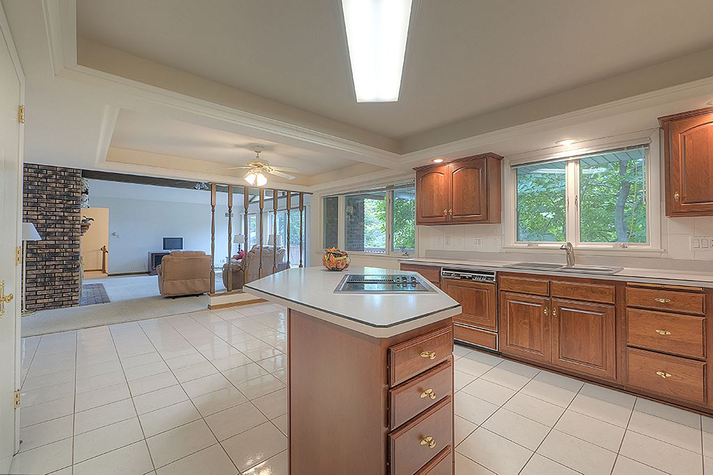 4215 Landstrom Road Rockford, IL 61114 - Photo 11 of 25 a kitchen with stainless steel appliances granite countertop a sink and a stove