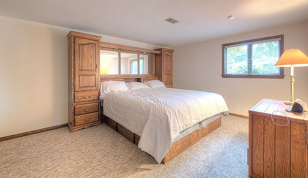 4215 Landstrom Road Rockford, IL 61114 - Photo 18 of 25 a bedroom with a bed and a window