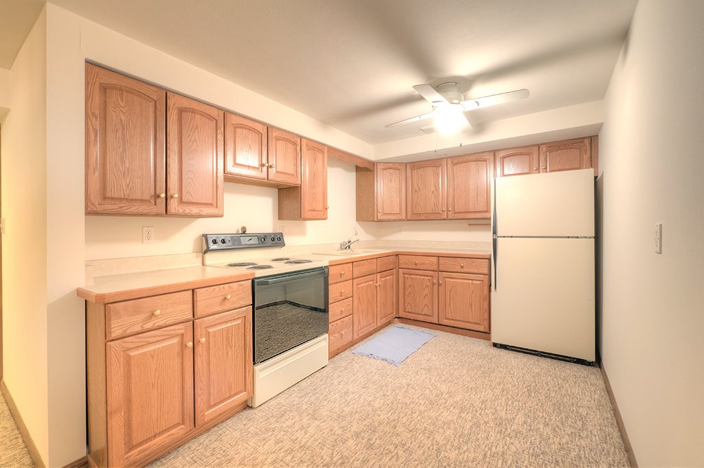4215 Landstrom Road Rockford, IL 61114 - Photo 19 of 25 a kitchen with white cabinets and white appliances