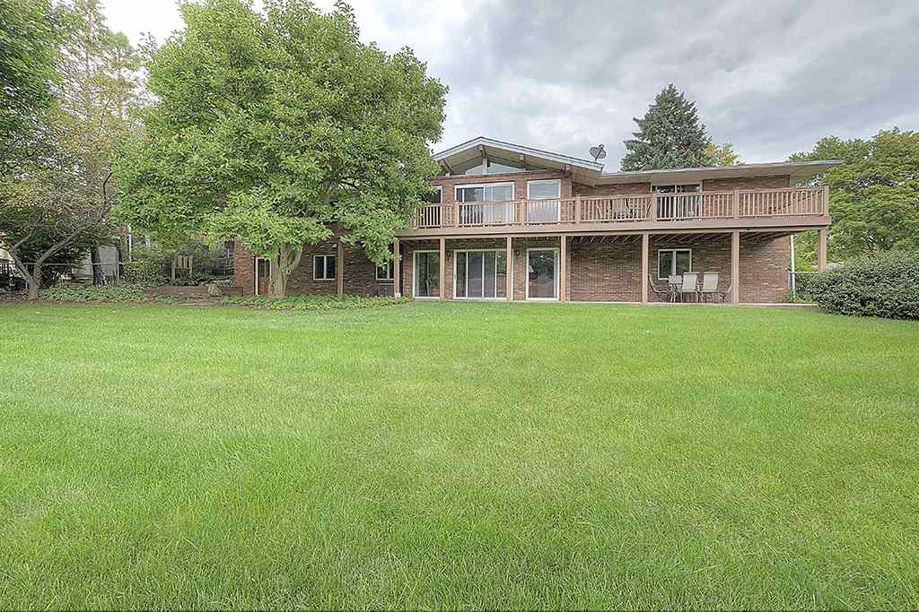 4215 Landstrom Road Rockford, IL 61114 - Photo 2 of 25 a front view of a house with a garden