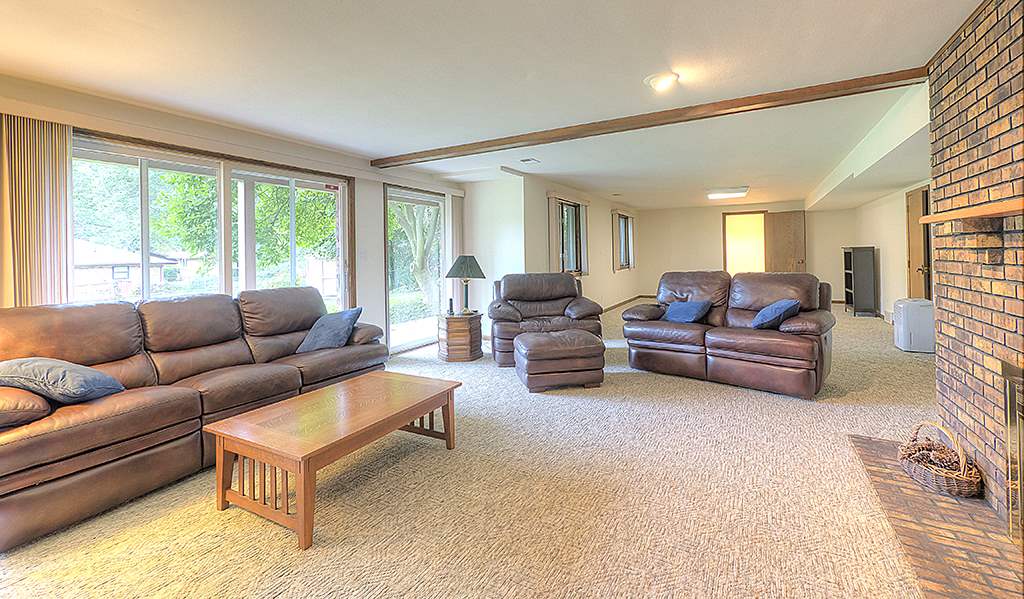 4215 Landstrom Road Rockford, IL 61114 - Photo 21 of 25 a living room with furniture and a large window