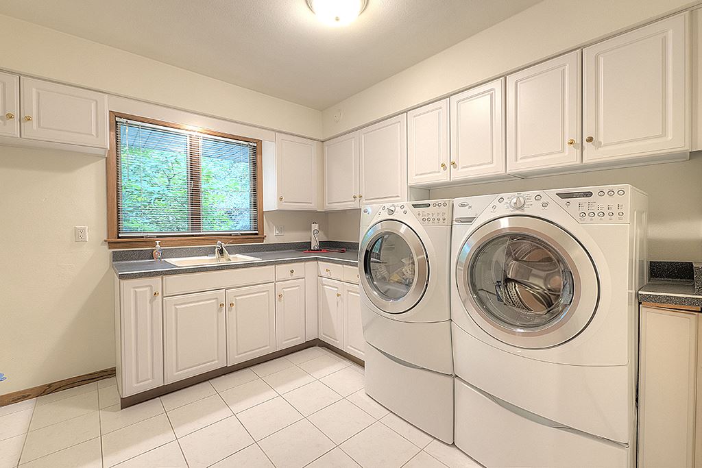 4215 Landstrom Road Rockford, IL 61114 - Photo 23 of 25 a kitchen with a sink cabinets and a window