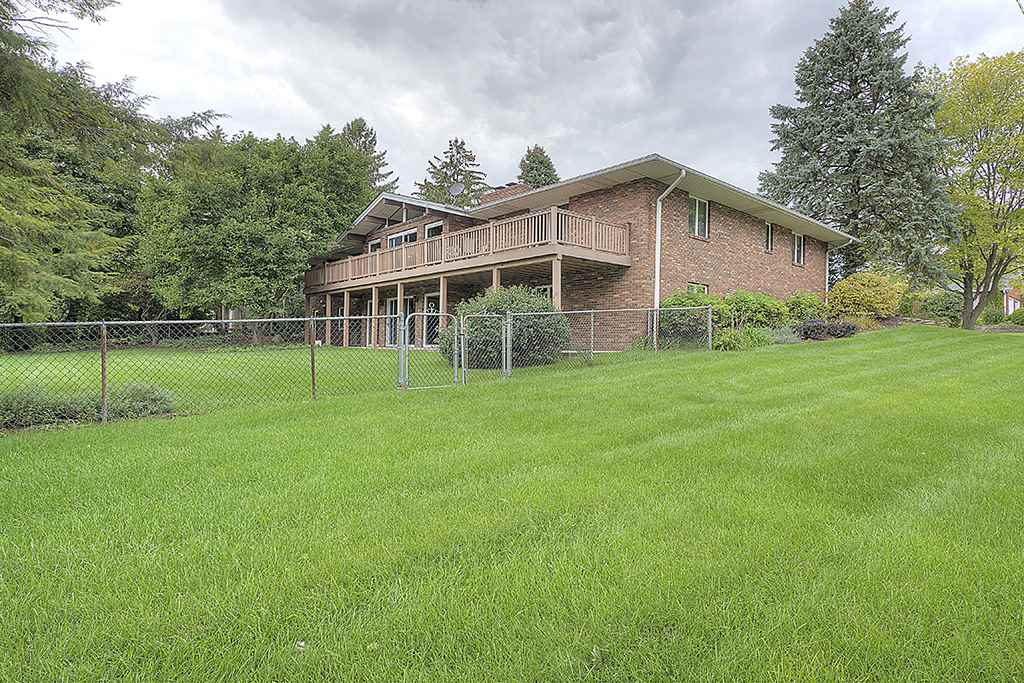 4215 Landstrom Road Rockford, IL 61114 - Photo 25 of 25 a view of a house with a backyard