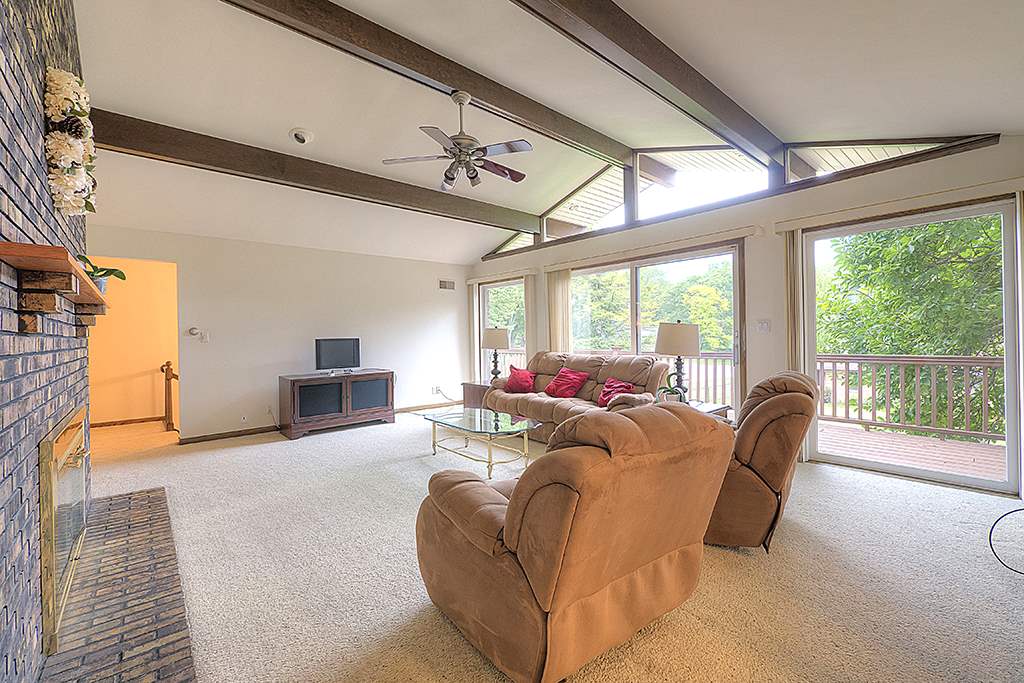 4215 Landstrom Road Rockford, IL 61114 - Photo 6 of 25 a living room with furniture and a large window
