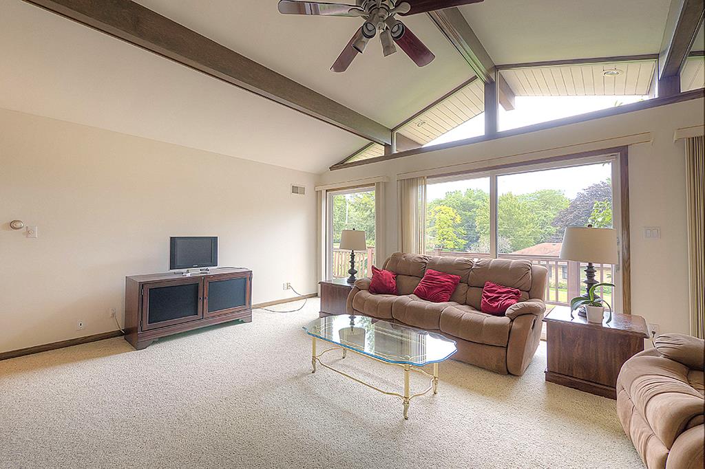4215 Landstrom Road Rockford, IL 61114 - Photo 7 of 25 a living room with furniture and a large window