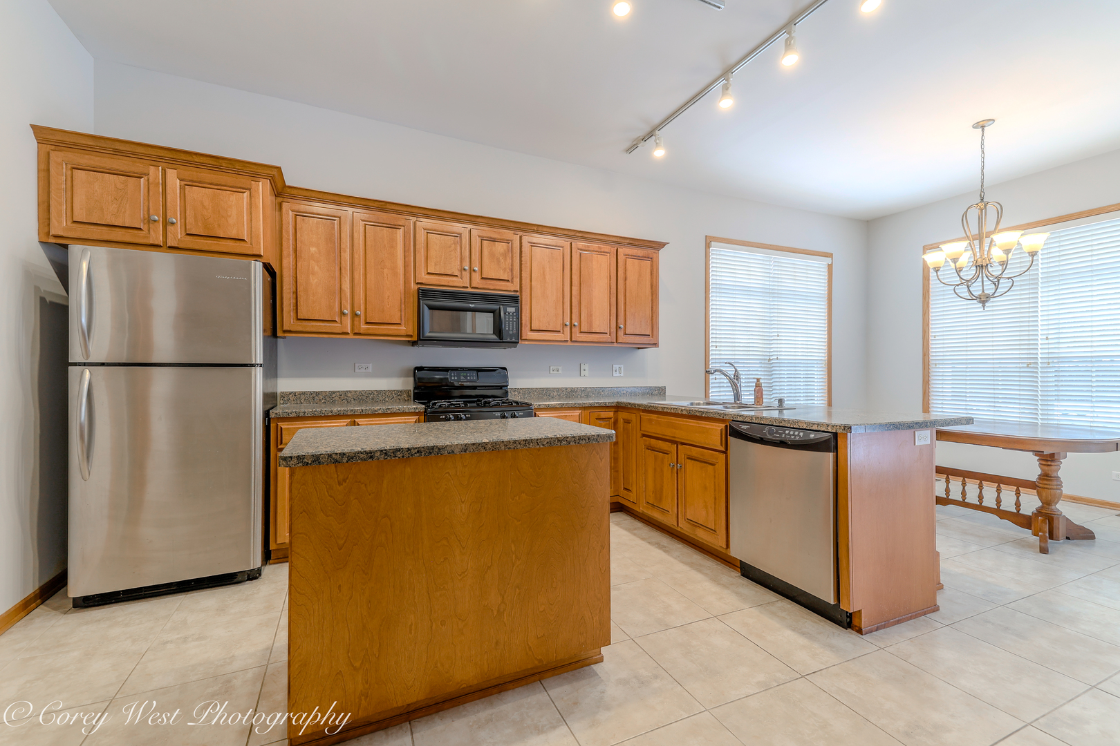 620 Ridge Drive Elburn, IL 60119 - Photo 15 of 46 a kitchen with stainless steel appliances granite countertop a refrigerator a stove a sink and a microwave
