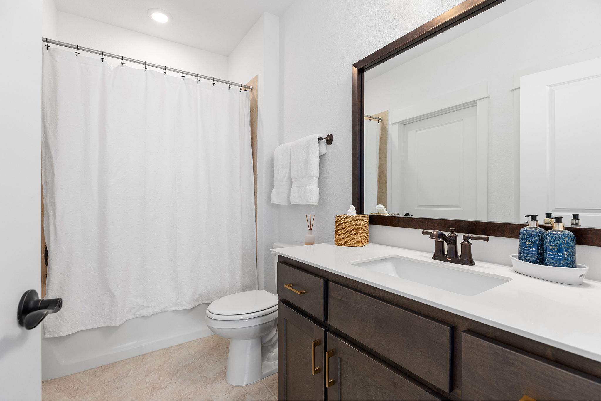 640 Martingale Street Georgetown, TX 78633 - Photo 12 of 39 Full bath with vanity, shower / tub combo with curtain, light tile patterned flooring, and recessed lighting