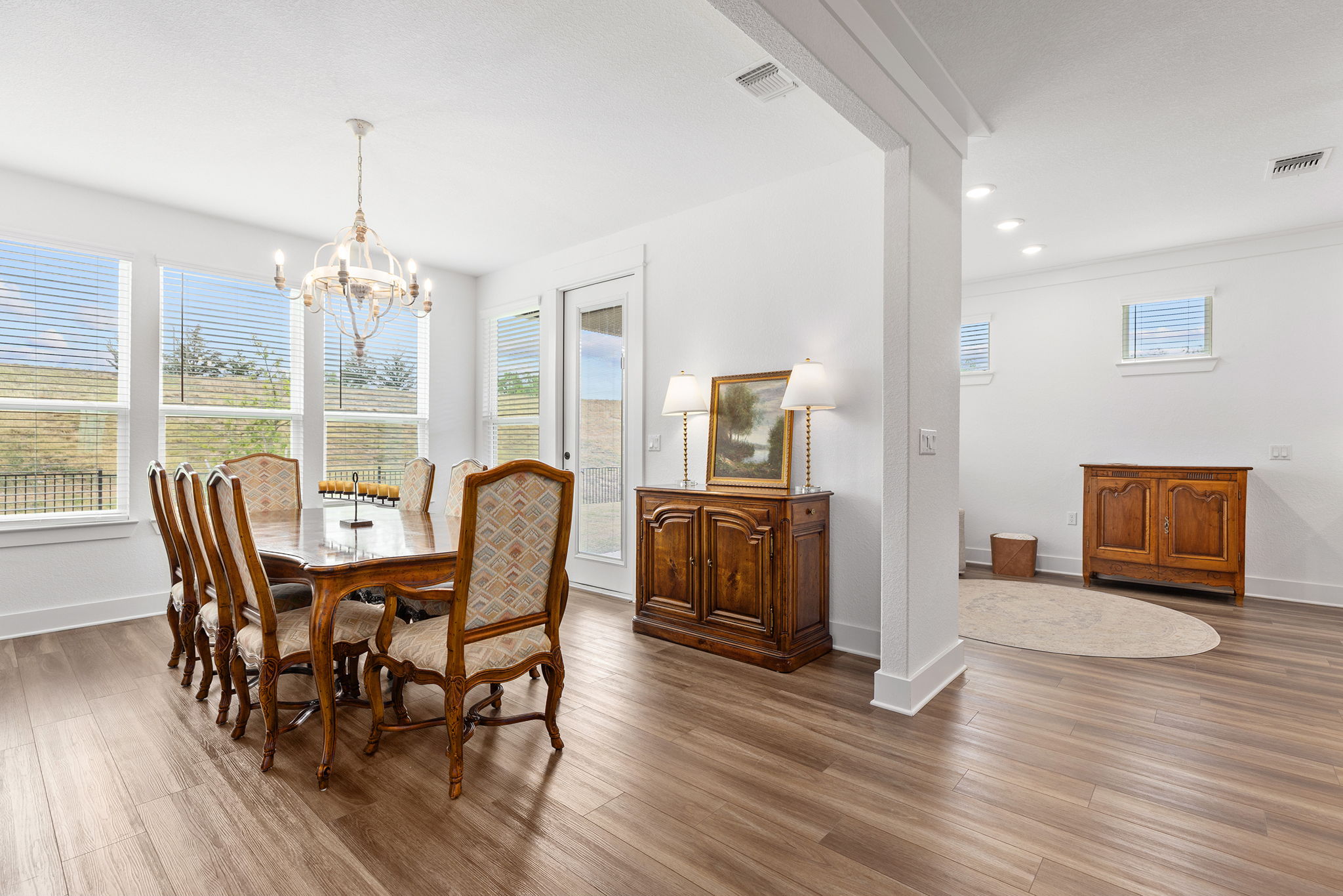640 Martingale Street Georgetown, TX 78633 - Photo 21 of 39 Dining space with hanging lights, wood finished floors, and ornamental molding