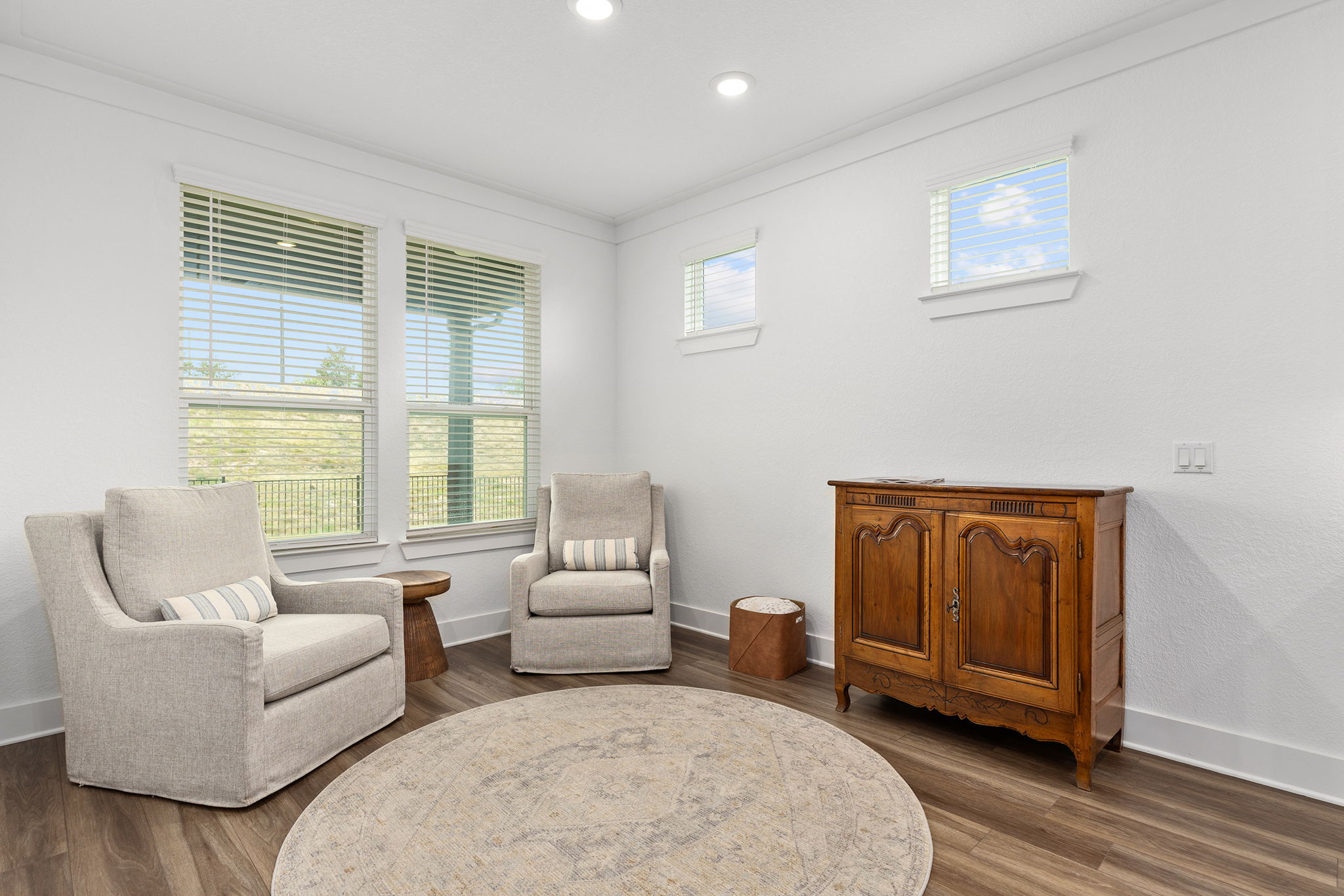 640 Martingale Street Georgetown, TX 78633 - Photo 24 of 39 Sitting room with dark wood-style flooring, ornamental molding, and recessed lighting