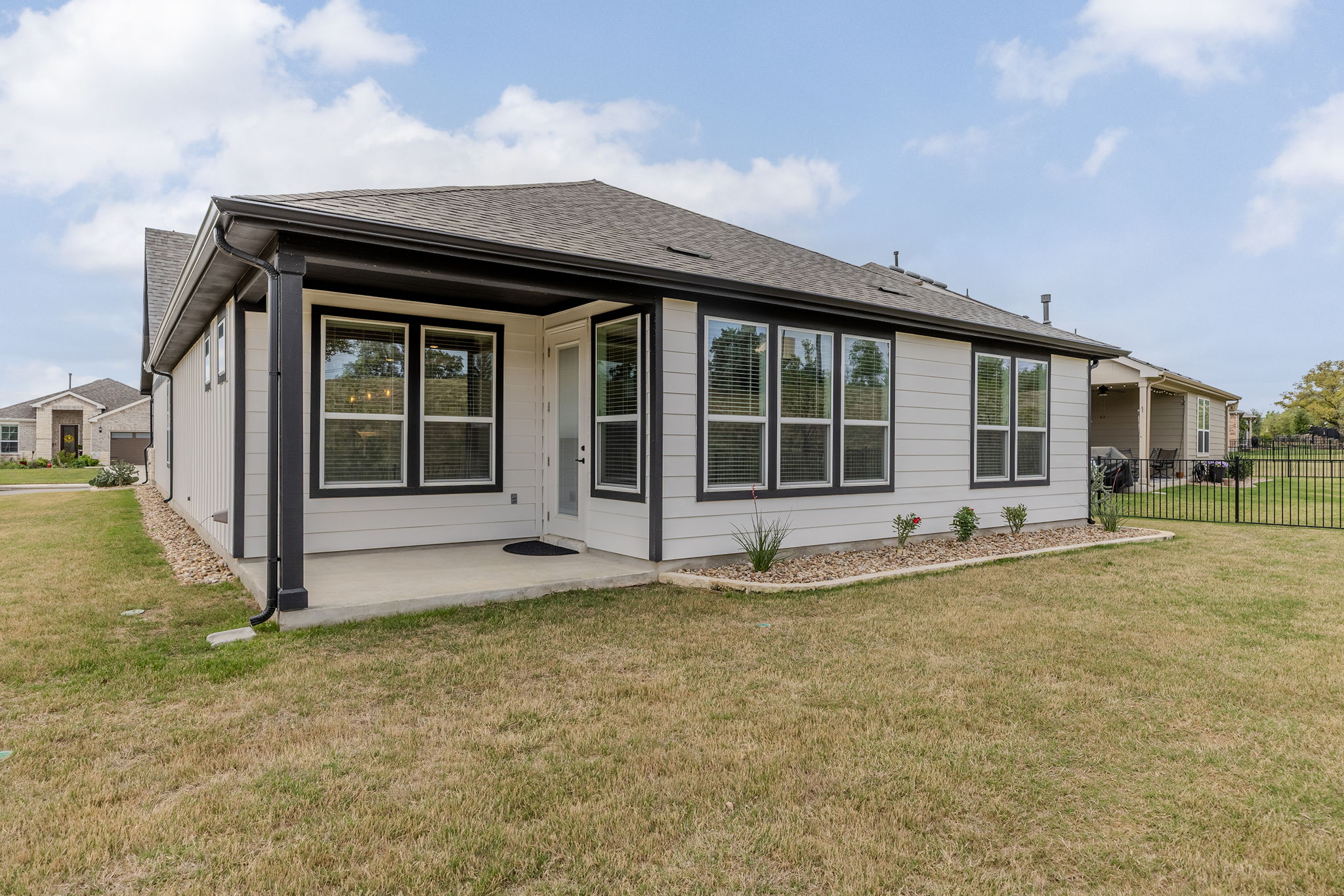 640 Martingale Street Georgetown, TX 78633 - Photo 35 of 39 Rear view of property featuring a patio area and roof with shingles
