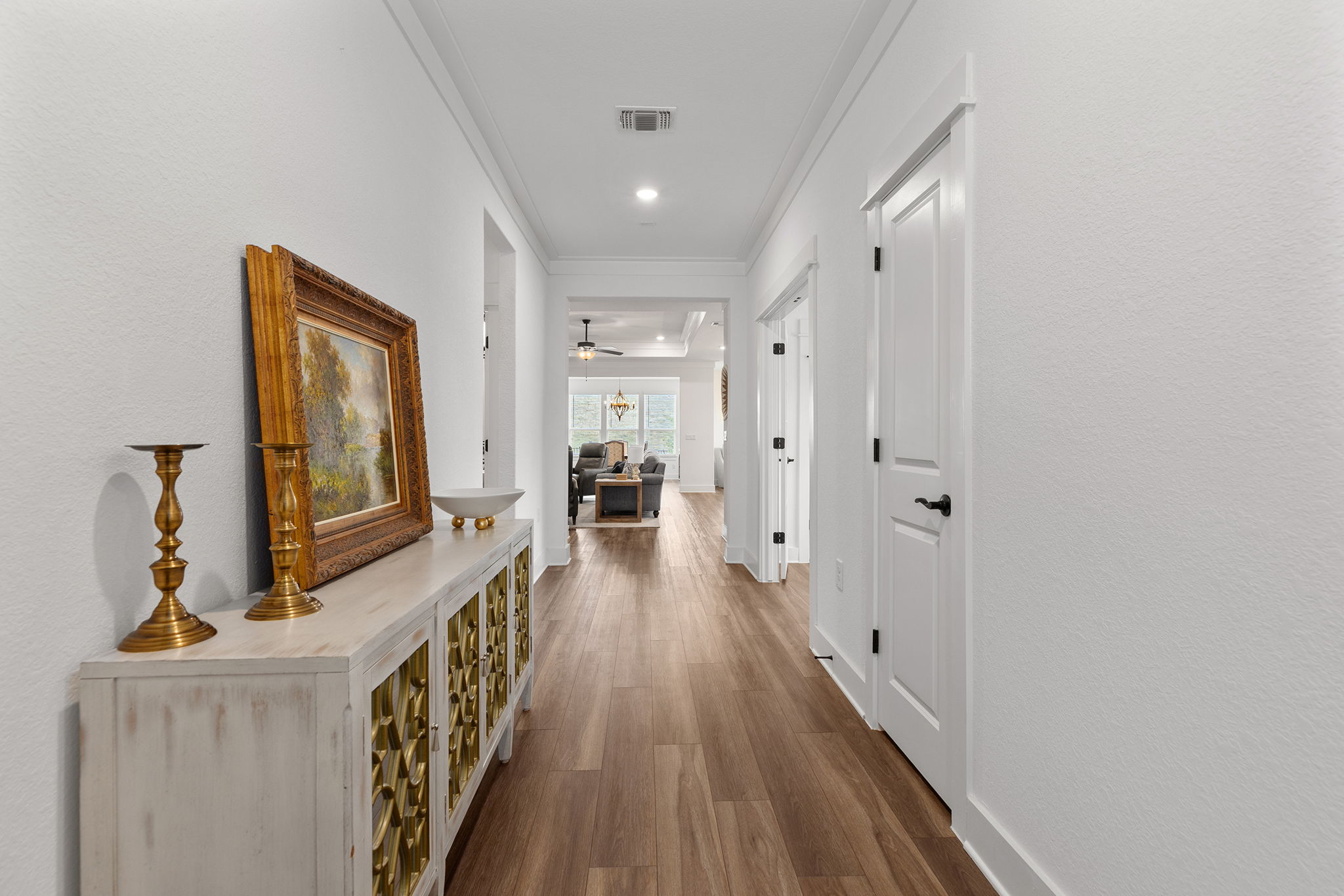 640 Martingale Street Georgetown, TX 78633 - Photo 5 of 39 Hallway featuring ornamental molding and dark wood-style floors