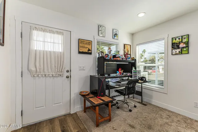 a work room with furniture and a window