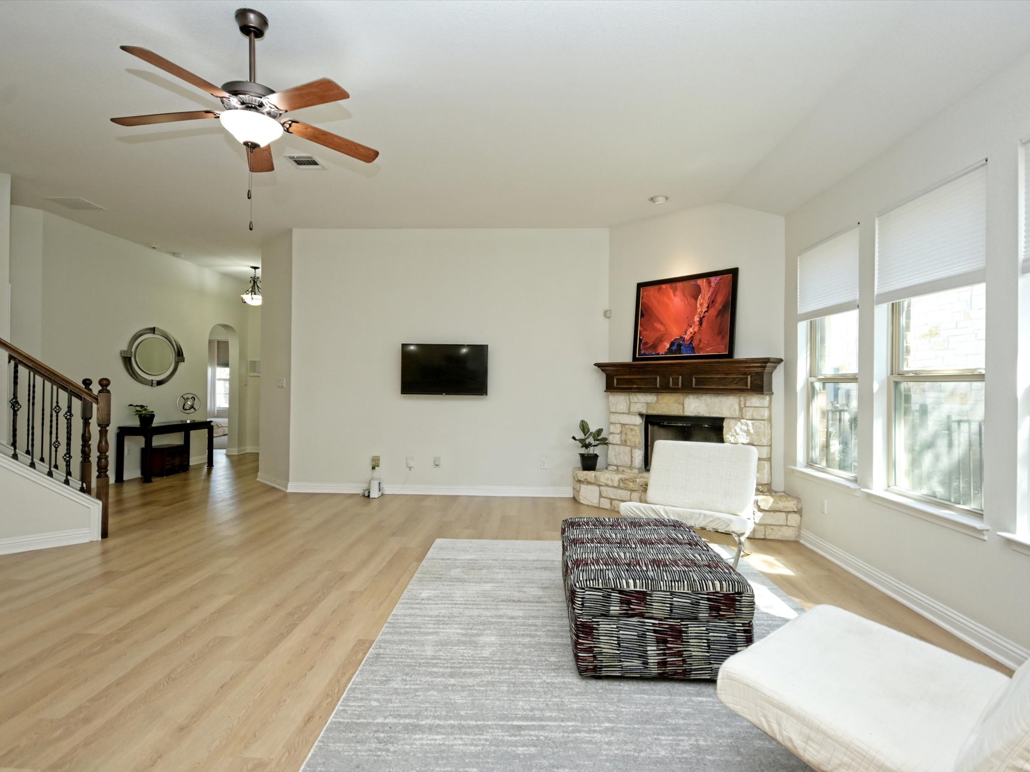 201 Bellagio Drive Austin, TX 78734 - Photo 10 of 31 Beautiful wood flooring runs along the entry foyer ind into the living room.