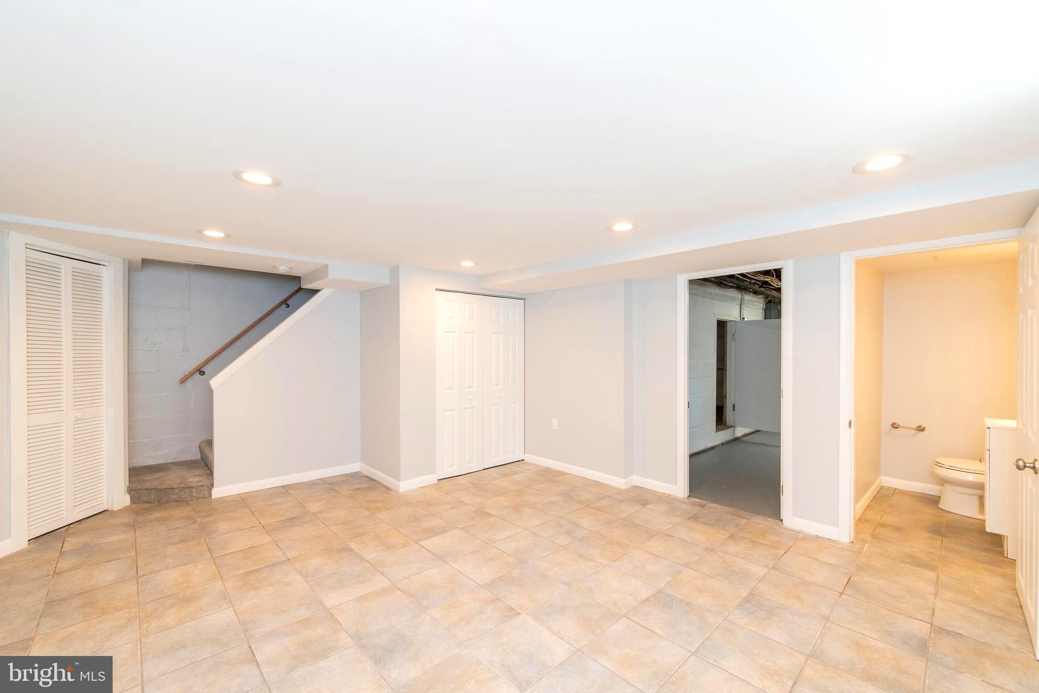 308 Hopkins Road Baltimore, MD 21212 - Photo 27 of 35 FINISHED LOWER LEVEL W/POWDER ROOM