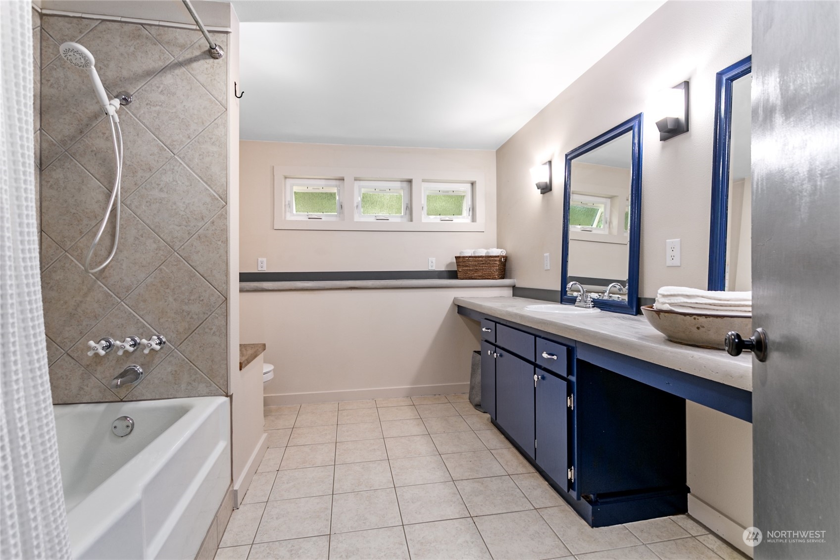 3734 Britton Road Bellingham, WA 98226 - Photo 19 of 40 a bathroom with a tub sink and mirror
