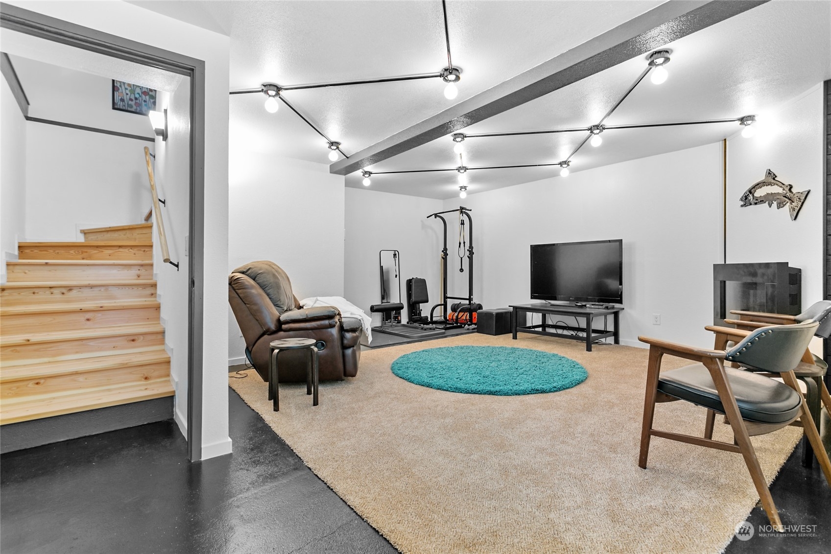 3734 Britton Road Bellingham, WA 98226 - Photo 21 of 40 a living room with furniture a flat screen tv and a table