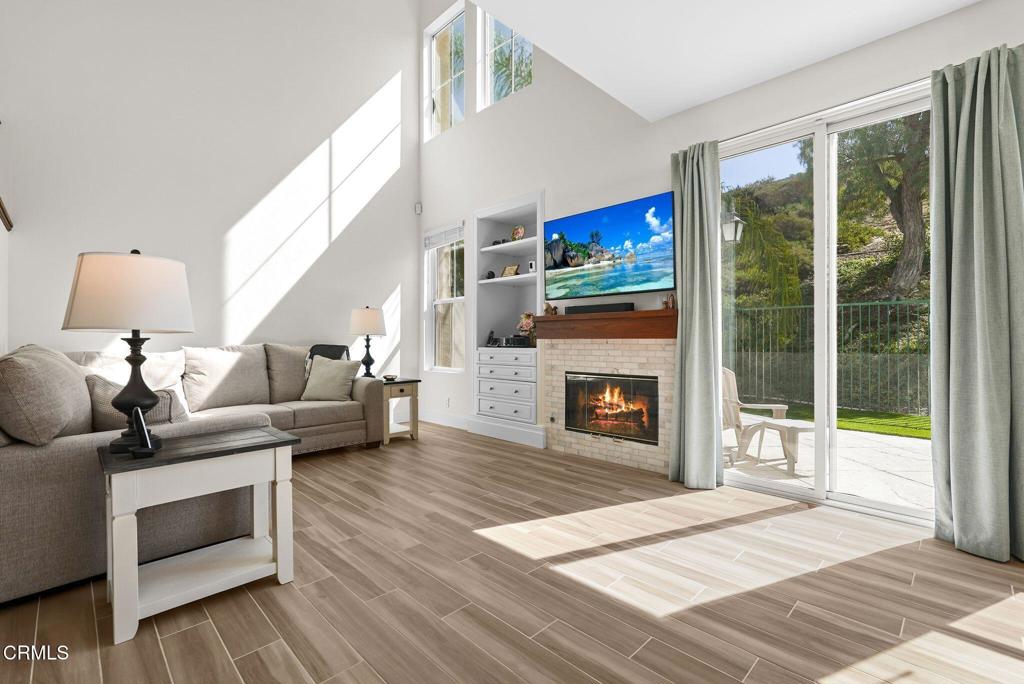 596 Fenwick Way, Unit C Simi Valley, CA 93065 - Photo 11 of 45 a living room with furniture and a fireplace