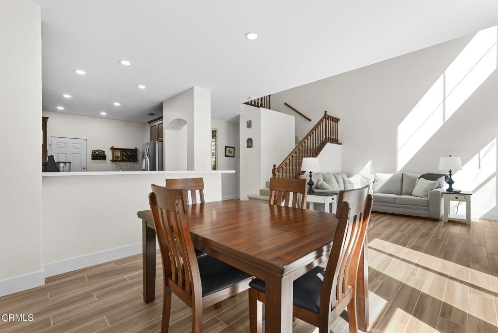 596 Fenwick Way, Unit C Simi Valley, CA 93065 - Photo 16 of 45 a view of a dining room with furniture and wooden floor