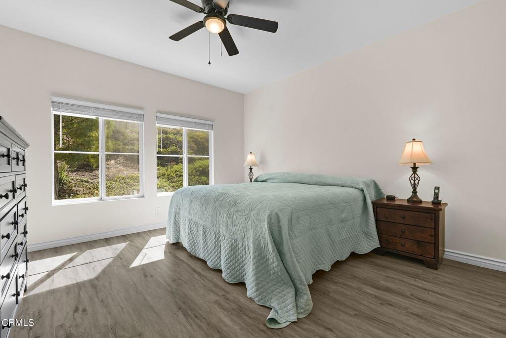 596 Fenwick Way, Unit C Simi Valley, CA 93065 - Photo 28 of 45 a spacious bedroom with a bed and a window