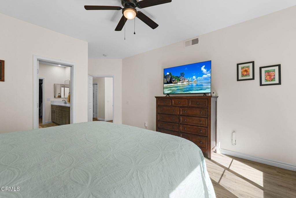 596 Fenwick Way, Unit C Simi Valley, CA 93065 - Photo 29 of 45 a bed room with a bed and a television