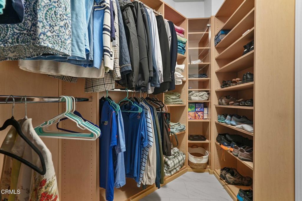 596 Fenwick Way, Unit C Simi Valley, CA 93065 - Photo 33 of 45 a view of walk in closet with clothes and shoes