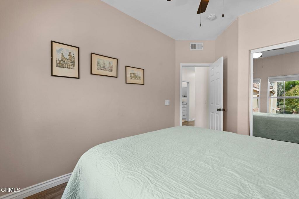 596 Fenwick Way, Unit C Simi Valley, CA 93065 - Photo 37 of 45 a bedroom with a bed and a window
