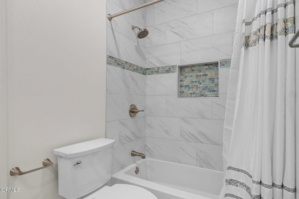 596 Fenwick Way, Unit C Simi Valley, CA 93065 - Photo 39 of 45 a bathroom with a toilet and shower