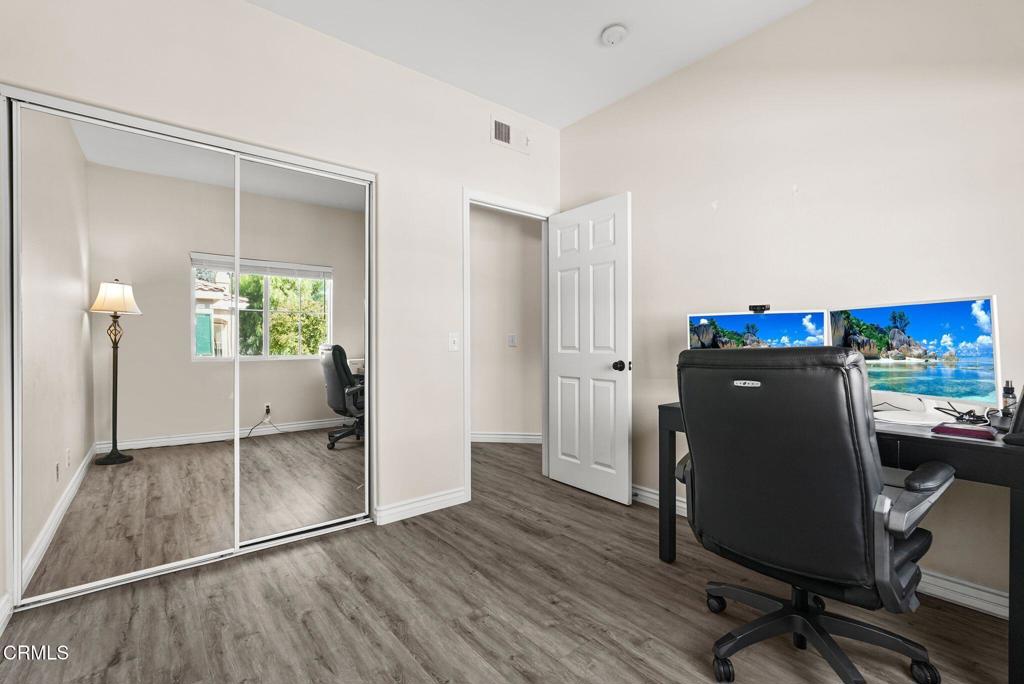 596 Fenwick Way, Unit C Simi Valley, CA 93065 - Photo 41 of 45 a view of a workspace with furniture and wooden floor