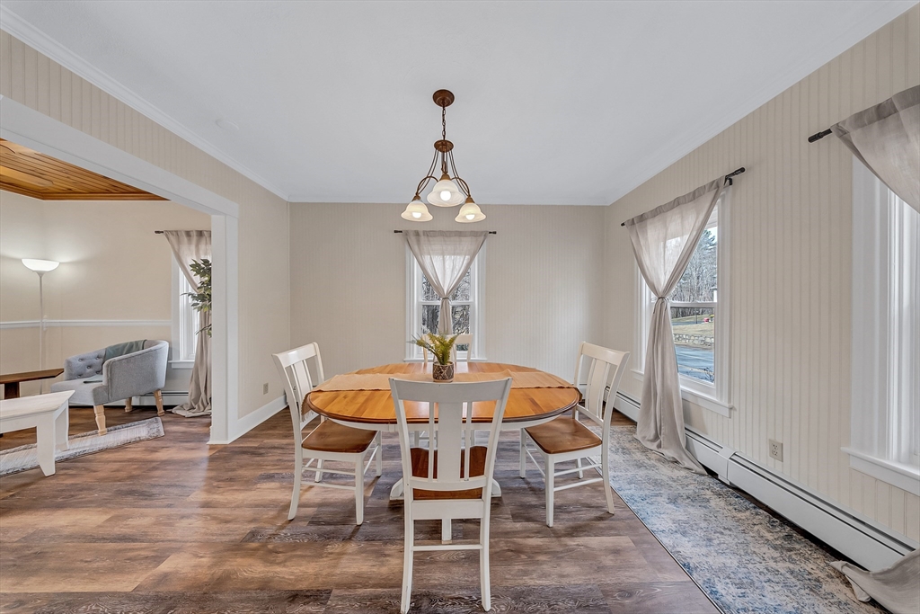 375 South Main Street Burrillville, RI 02859 - Photo 14 of 39 a view of a dining room with furniture window and wooden floor