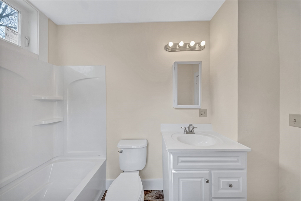 375 South Main Street Burrillville, RI 02859 - Photo 16 of 39 a bathroom with a sink a toilet and a mirror