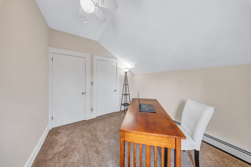 375 South Main Street Burrillville, RI 02859 - Photo 21 of 39 a living room with a couch and a chandelier