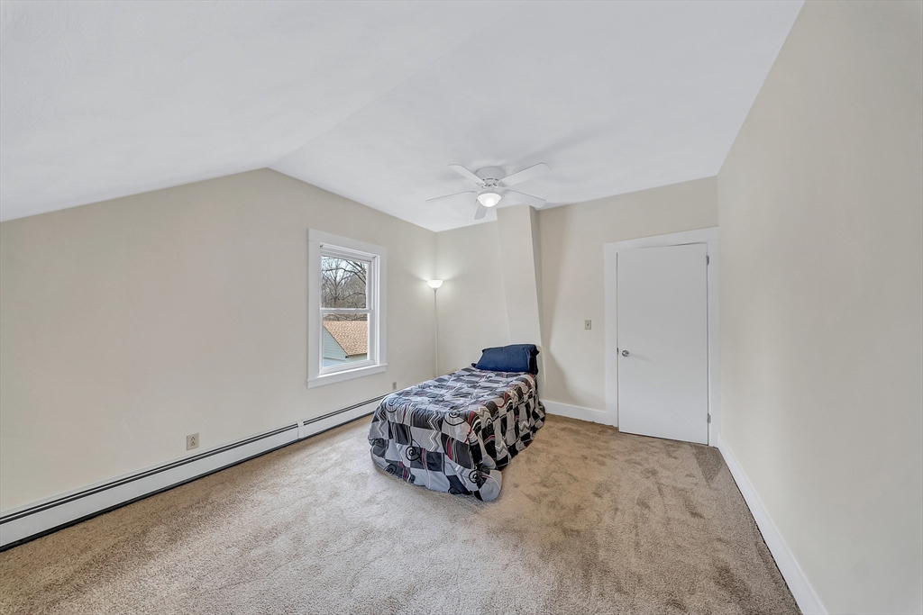 375 South Main Street Burrillville, RI 02859 - Photo 23 of 39 a spacious bedroom with a bed and a window