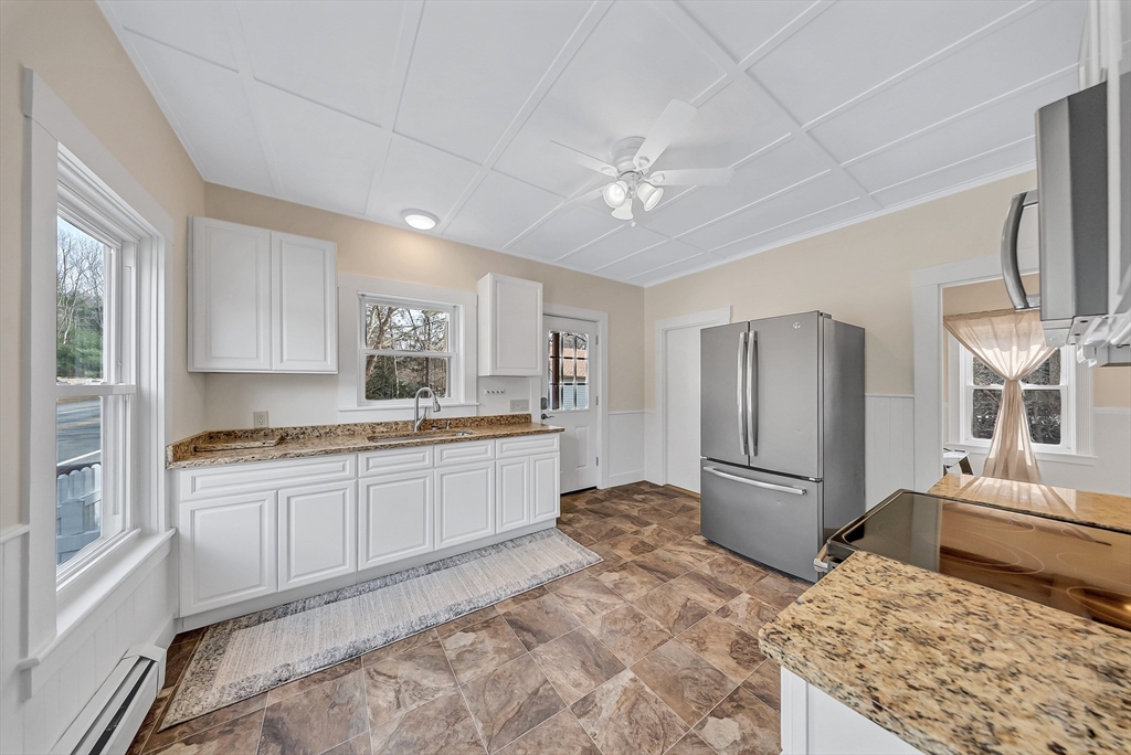 375 South Main Street Burrillville, RI 02859 - Photo 5 of 39 a large kitchen with granite countertop a refrigerator and a stove