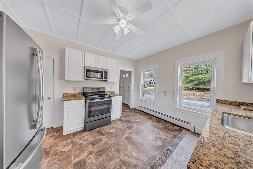 375 South Main Street Burrillville, RI 02859 - Photo 7 of 39 a kitchen with stainless steel appliances granite countertop a stove a refrigerator and a sink