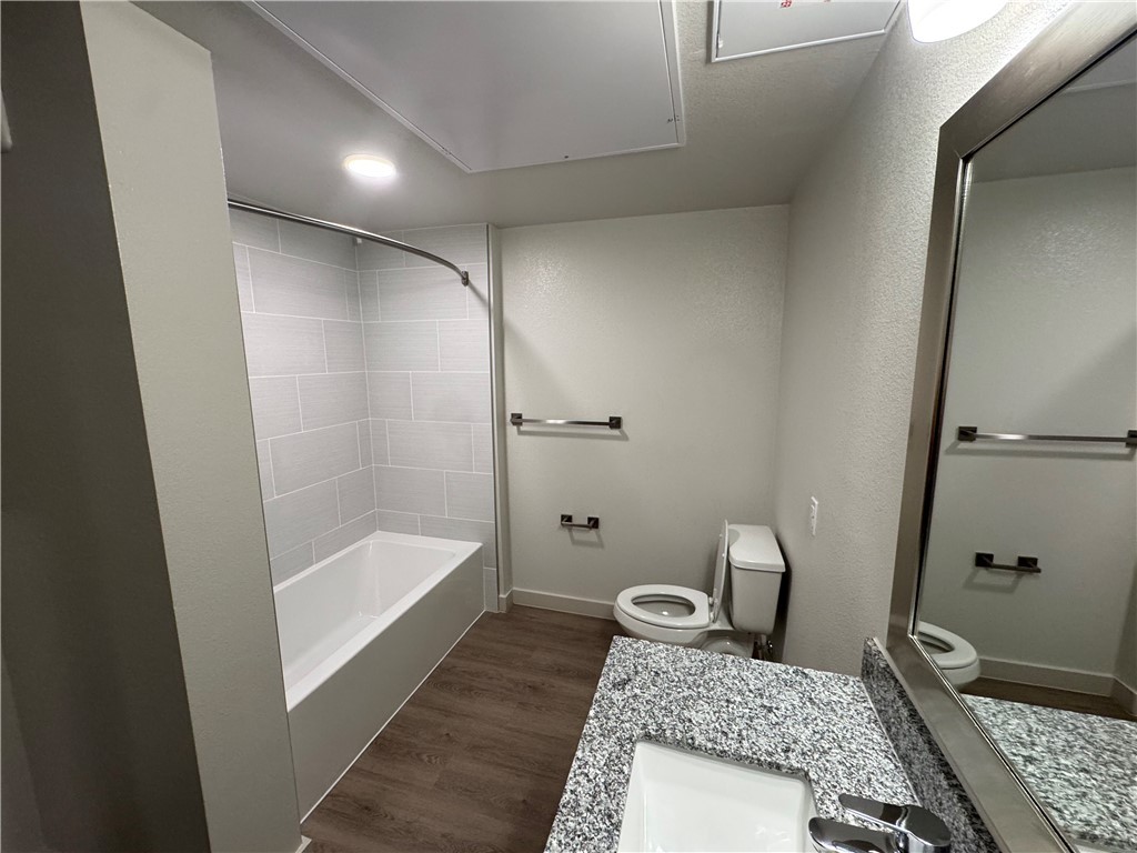 6000 Jones Road, Unit 4202 Bryan, TX 77807 - Photo 14 of 19 a bathroom with a granite countertop sink a toilet and shower