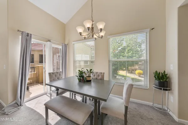 a view of a dining room with furniture window and outside view