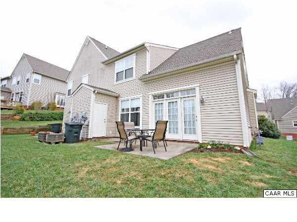 1340 Stoney Ridge Road Charlottesville, VA 22902 - Photo 13 of 14 a backyard of a house with table and chairs