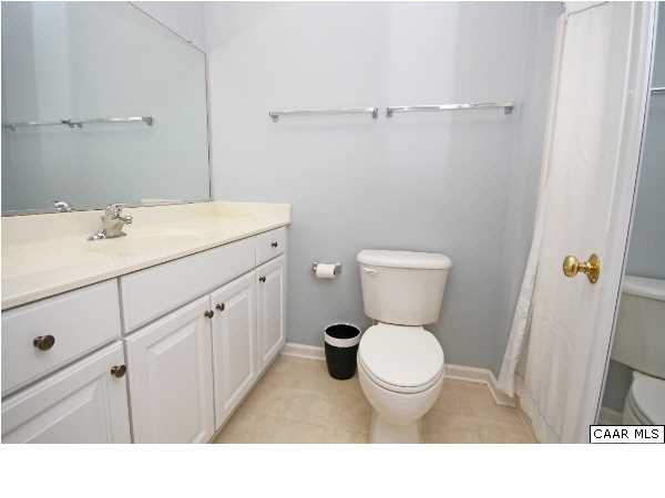 1340 Stoney Ridge Road Charlottesville, VA 22902 - Photo 5 of 14 a bathroom with a toilet sink and mirror