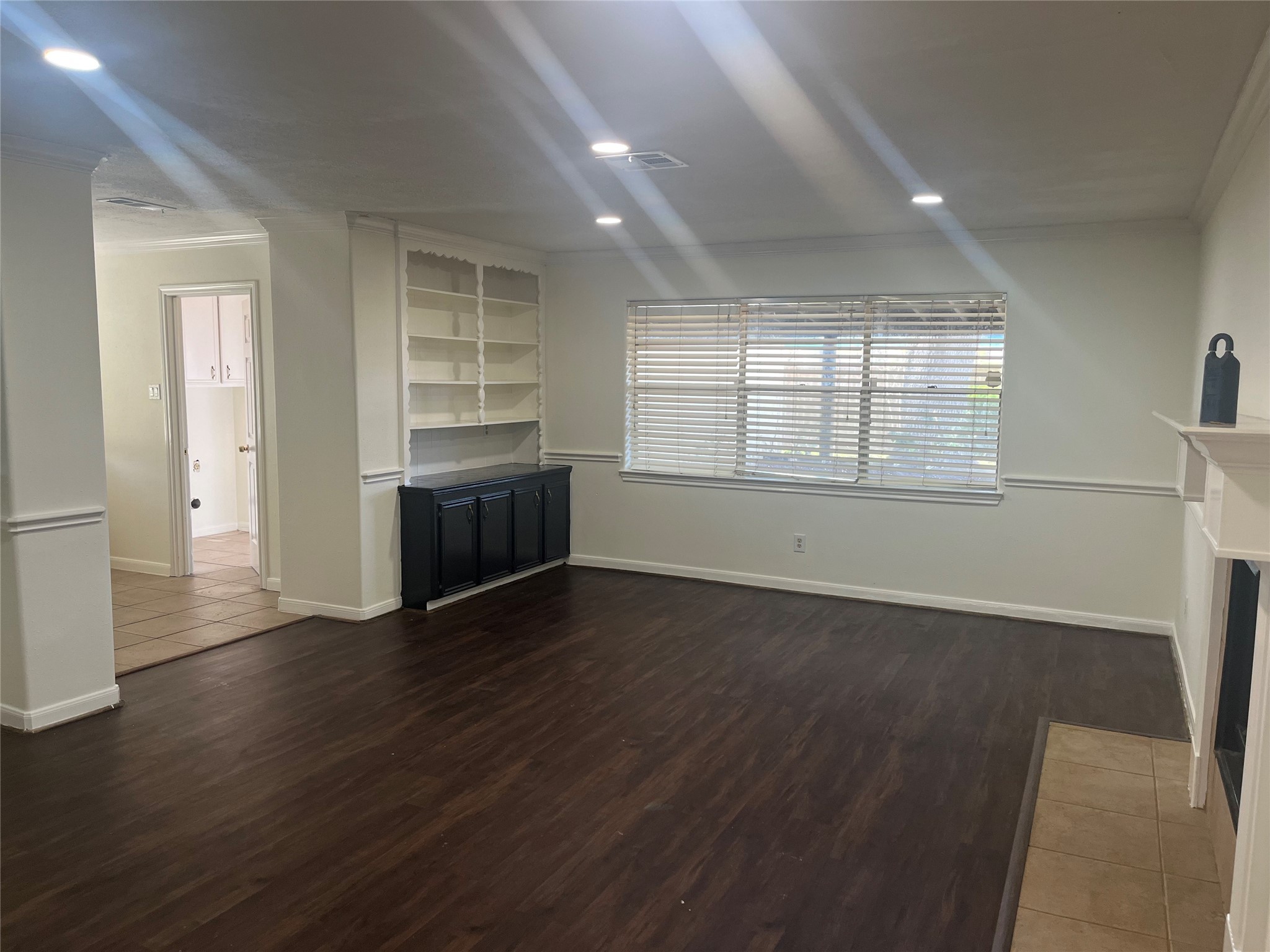 15230 Steeple Chase Road Houston, TX 77489 - Photo 2 of 8 an empty room with wooden floor and window
