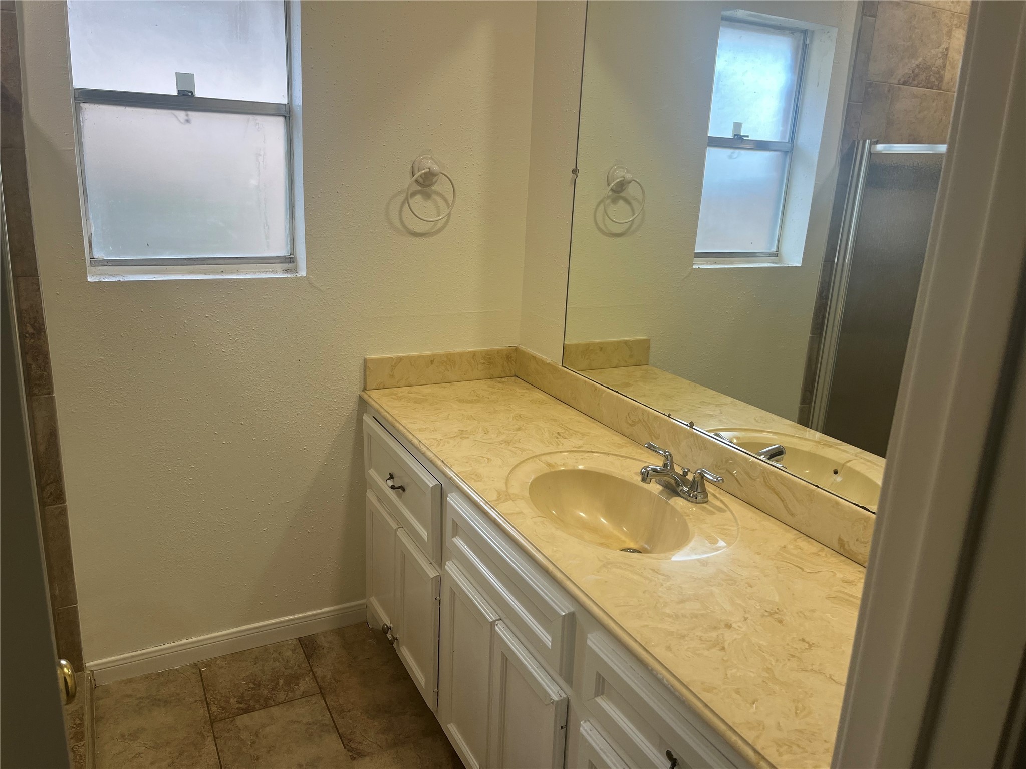 15230 Steeple Chase Road Houston, TX 77489 - Photo 7 of 8 a bathroom with a granite countertop sink and a mirror